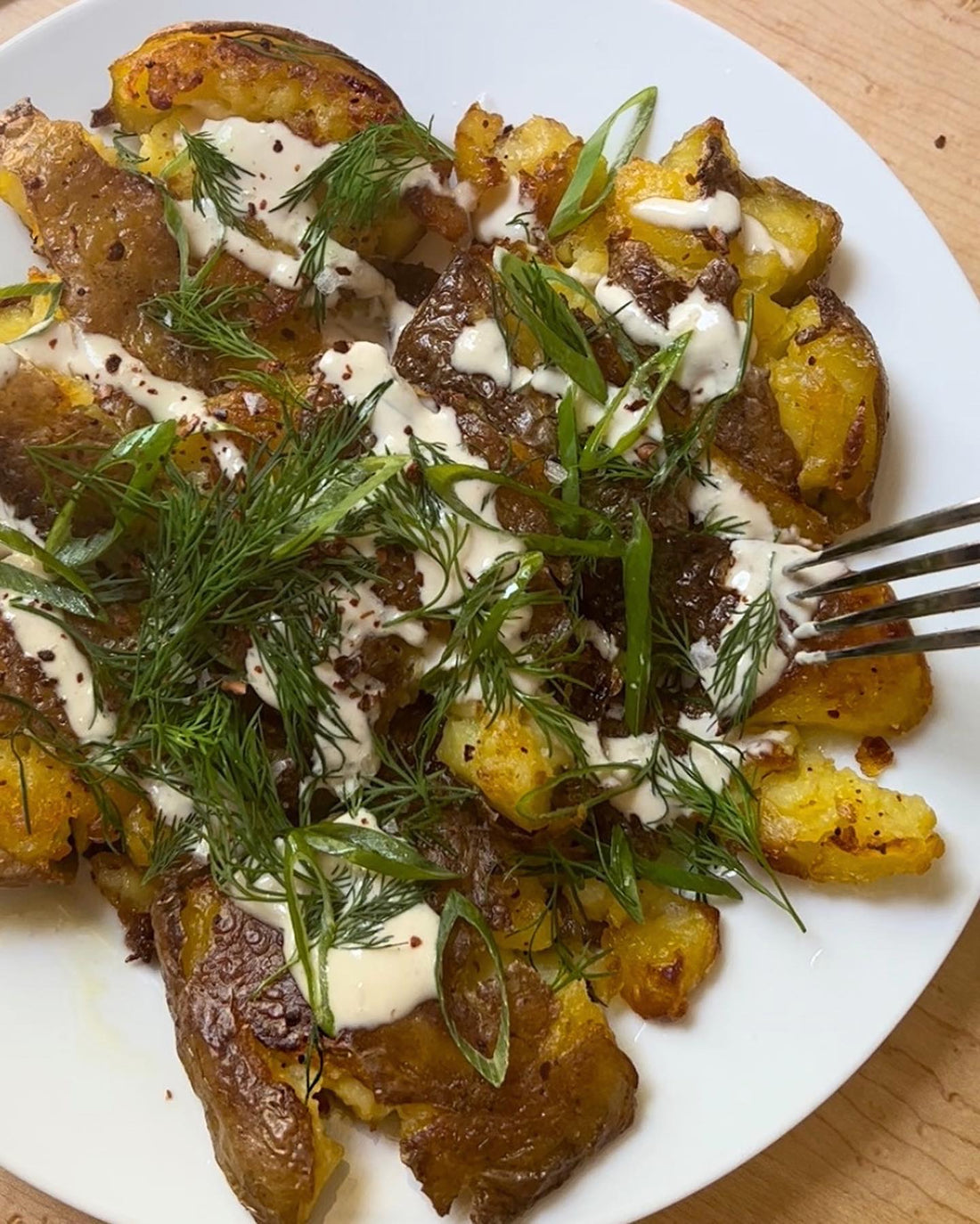 Crispy Smashed Potatoes with Tahini Sauce and Herbs